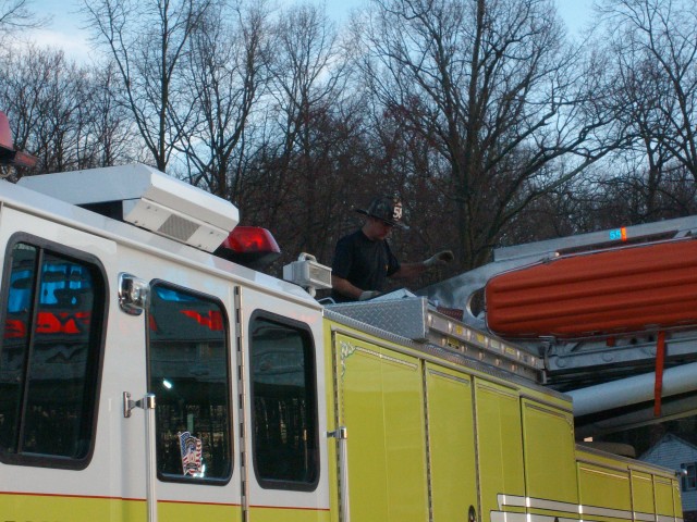 Firefighter John Woods operating the ladder